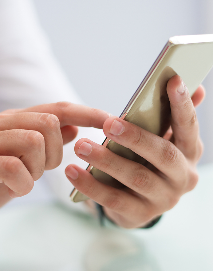 close-up-of-male-hands-using-smartphone